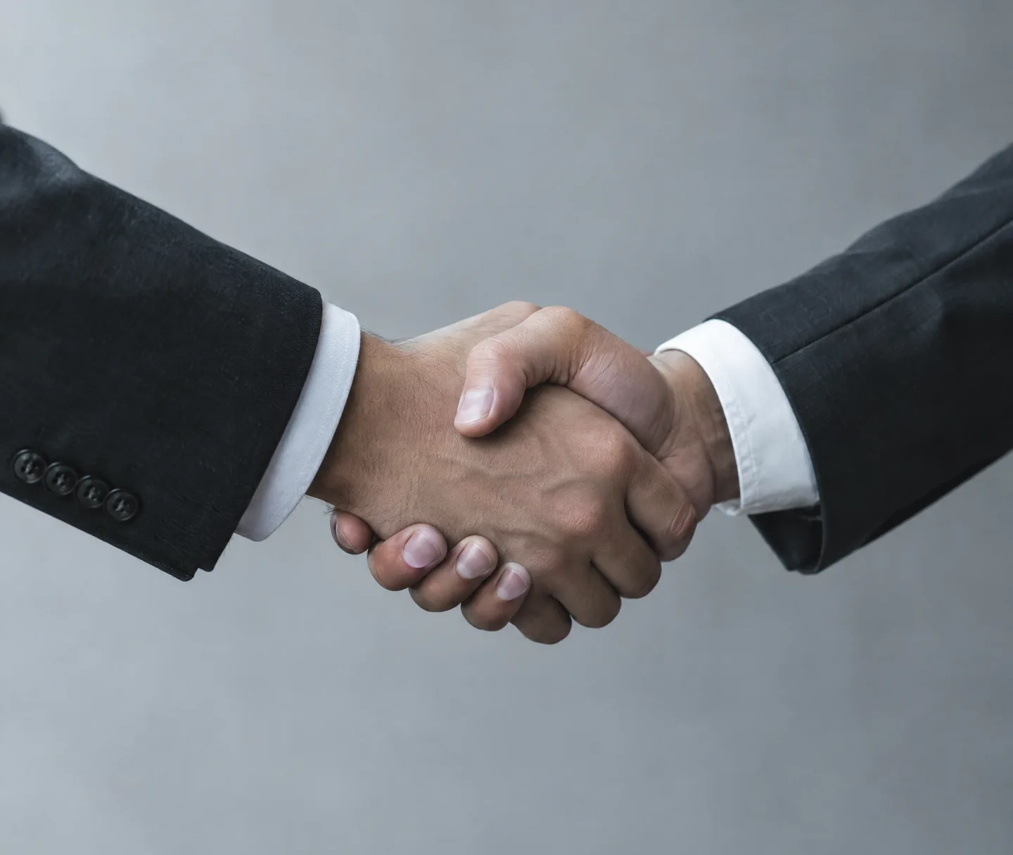 A handshake close-up, monochrome